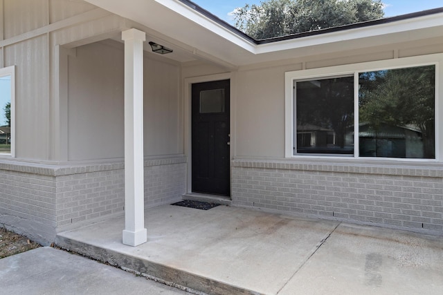 property entrance with a patio area