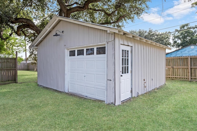 garage featuring a lawn