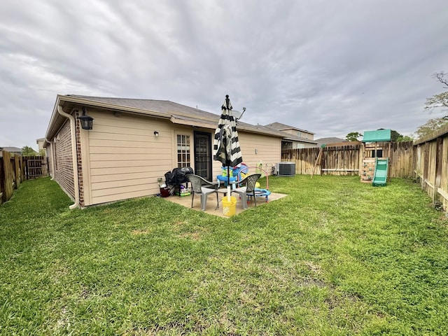 22043 Rocky Reserve Dr, Northwest Harris, TX 77447 - back of house with a fenced backyard, a lawn, a patio, and a playground