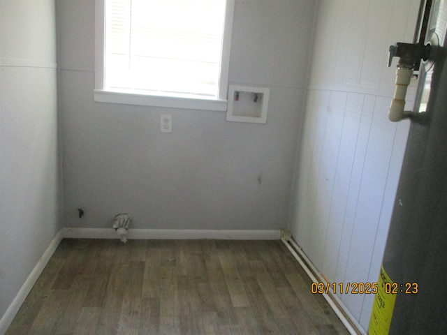 laundry room with laundry area, wood finished floors, baseboards, and washer hookup