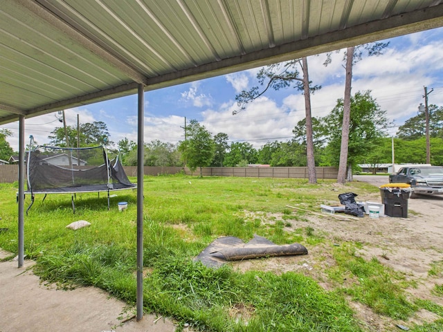 1325 S Main St, Vidor, TX 77662 - view of yard featuring fence and a trampoline