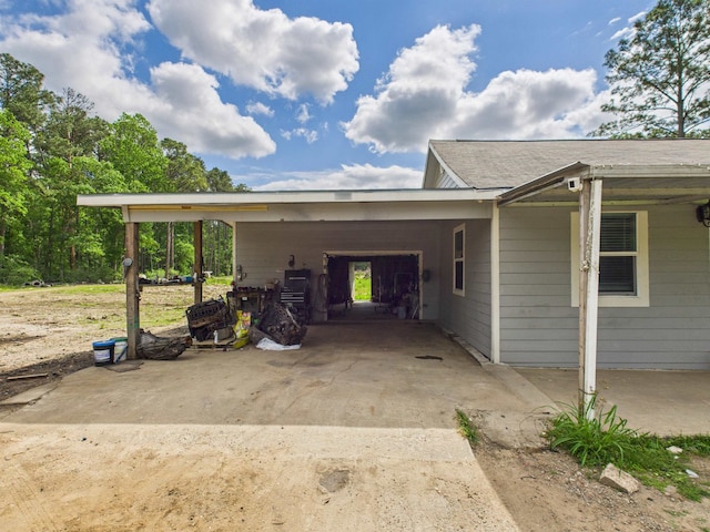 1325 S Main St, Vidor, TX 77662 - view of side of home featuring driveway and an attached carport