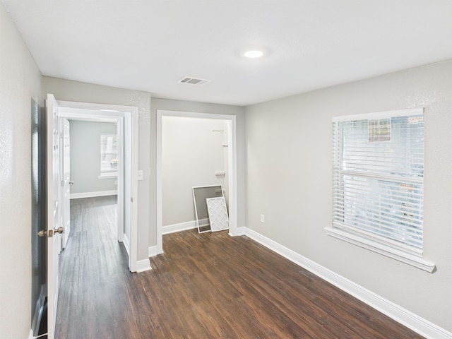 1325 S Main St, Vidor, TX 77662 - interior space with dark wood finished floors, baseboards, and visible vents