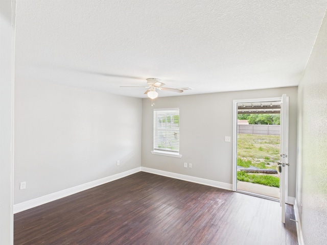 1325 S Main St, Vidor, TX 77662 - unfurnished room featuring visible vents, baseboards, dark wood-style floors, and ceiling fan