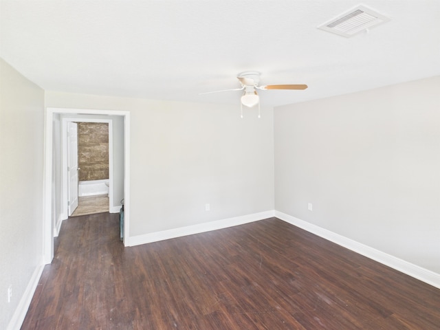 1325 S Main St, Vidor, TX 77662 - unfurnished room featuring a ceiling fan, baseboards, dark wood-style flooring, and visible vents
