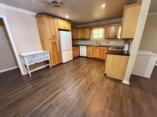 220 Dupuis St, Bridge City, TX 77611 - kitchen featuring white appliances, ornamental molding, dark countertops, dark wood-type flooring, and baseboards
