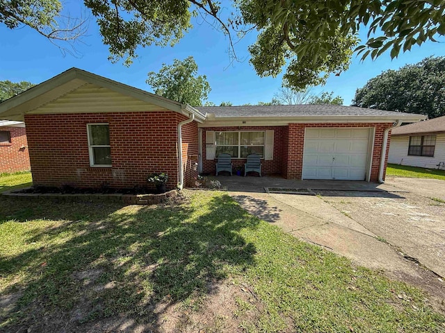 220 Dupuis St, Bridge City, TX 77611 - ranch-style house featuring driveway, a garage, brick siding, and a front yard