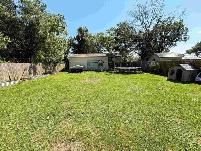 220 Dupuis St, Bridge City, TX 77611 - view of yard with a trampoline