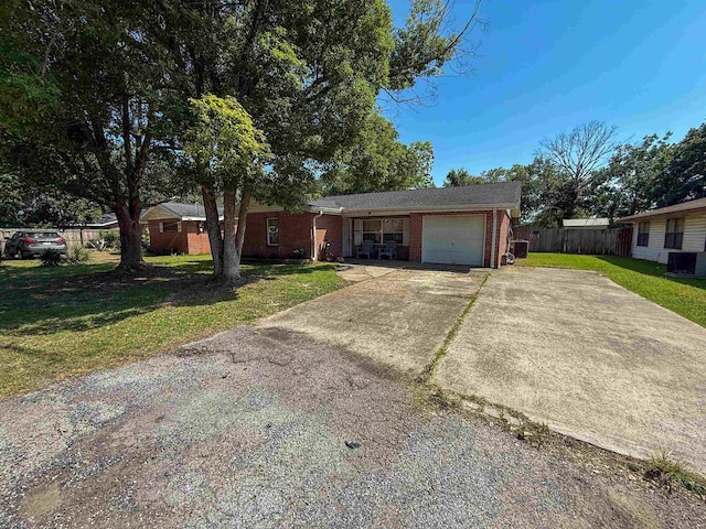 220 Dupuis St, Bridge City, TX 77611 - ranch-style house featuring an attached garage, brick siding, and concrete driveway