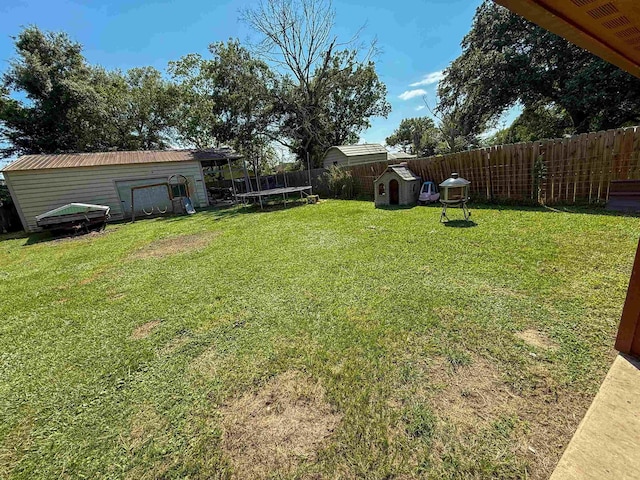 220 Dupuis St, Bridge City, TX 77611 - view of yard featuring a trampoline