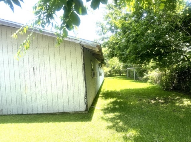 view of property exterior with a lawn