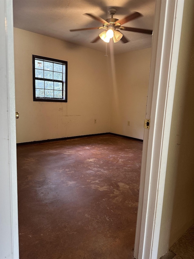 empty room featuring ceiling fan