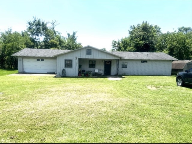 ranch-style house with a front yard and a garage