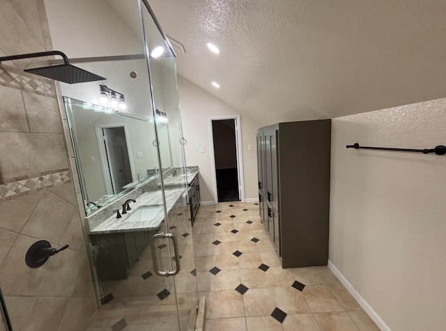 1401 Buckingham Dr, Orange, TX 77632 - full bath featuring a shower stall, a textured ceiling, double vanity, vaulted ceiling, and baseboards