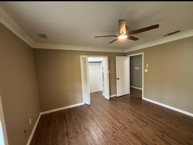 1401 Buckingham Dr, Orange, TX 77632 - spare room with a ceiling fan, dark wood-style flooring, crown molding, and baseboards