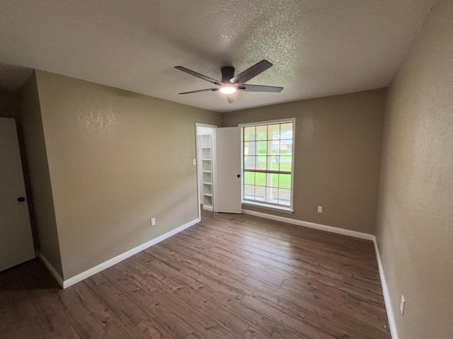 1401 Buckingham Dr, Orange, TX 77632 - spare room with ceiling fan, wood finished floors, baseboards, a textured ceiling, and a textured wall