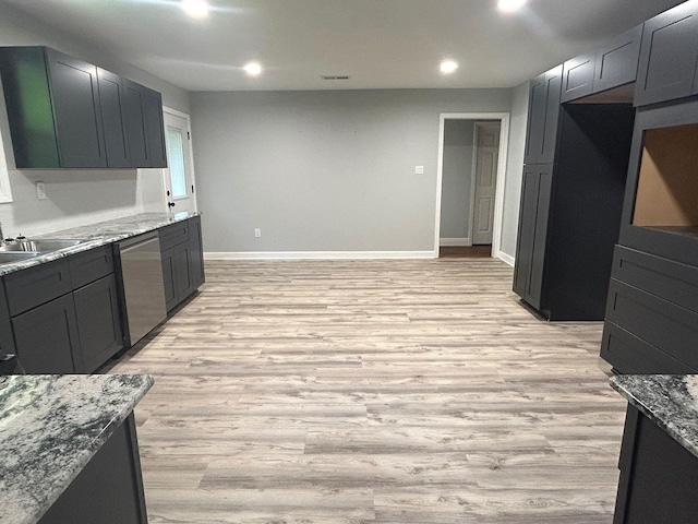850 Orange St, Vidor, TX 77662 - kitchen with stainless steel dishwasher, light wood-type flooring, light stone countertops, and recessed lighting