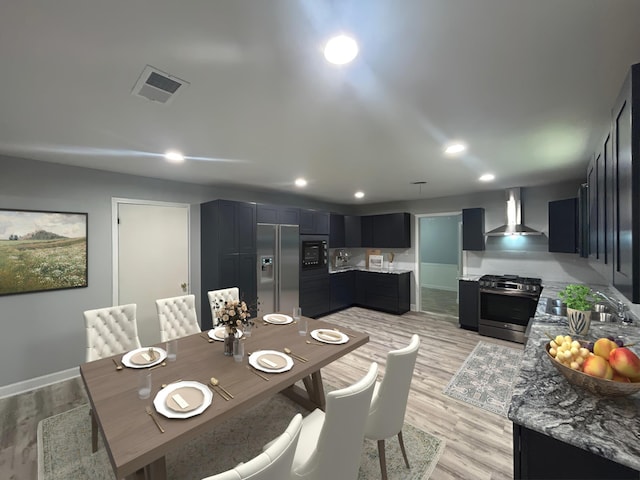 850 Orange St, Vidor, TX 77662 - dining space with light wood-type flooring and recessed lighting