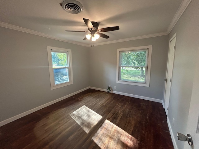 850 Orange St, Vidor, TX 77662 - unfurnished room with healthy amount of natural light, ceiling fan, crown molding, and dark wood-style floors