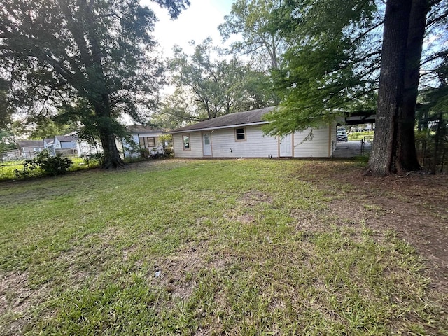 850 Orange St, Vidor, TX 77662 - view of yard featuring an attached carport