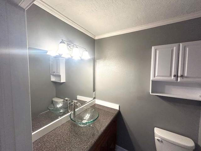 850 Orange St, Vidor, TX 77662 - half bathroom with crown molding, vanity, and a textured ceiling