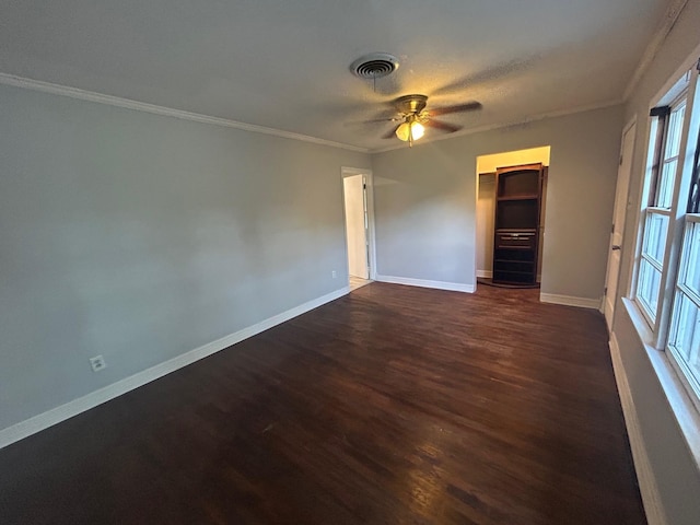850 Orange St, Vidor, TX 77662 - spare room with dark wood-style floors, crown molding, and ceiling fan