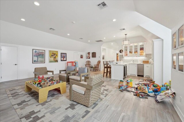 5160 Littlechase Dr, Beaumont, TX 77706 - rec room featuring light wood finished floors, vaulted ceiling, and recessed lighting