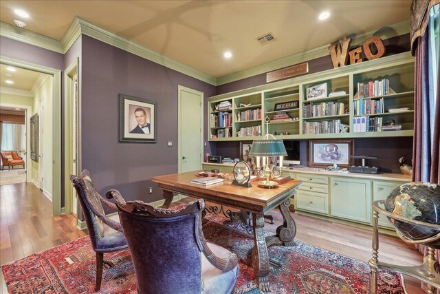 5160 Littlechase Dr, Beaumont, TX 77706 - office space with crown molding, light wood-style floors, built in desk, and baseboards