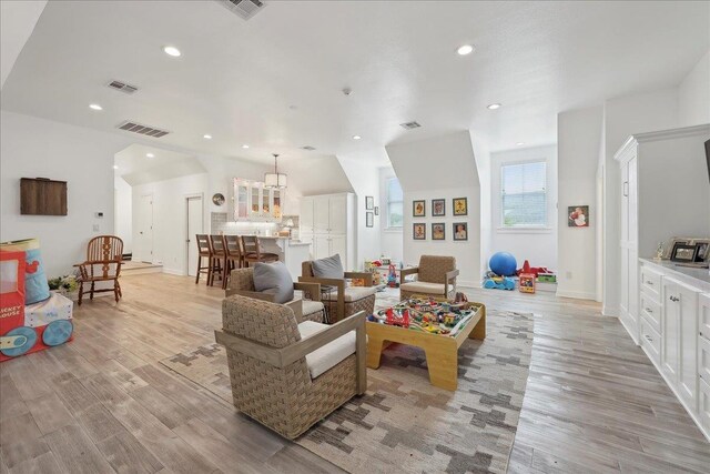 5160 Littlechase Dr, Beaumont, TX 77706 - living area with light wood finished floors, recessed lighting, and baseboards