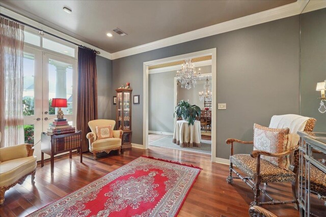 5160 Littlechase Dr, Beaumont, TX 77706 - sitting room with crown molding, healthy amount of natural light, wood finished floors, baseboards, and recessed lighting
