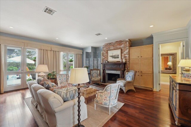 5160 Littlechase Dr, Beaumont, TX 77706 - living area featuring ornamental molding, dark wood finished floors, a fireplace, and french doors