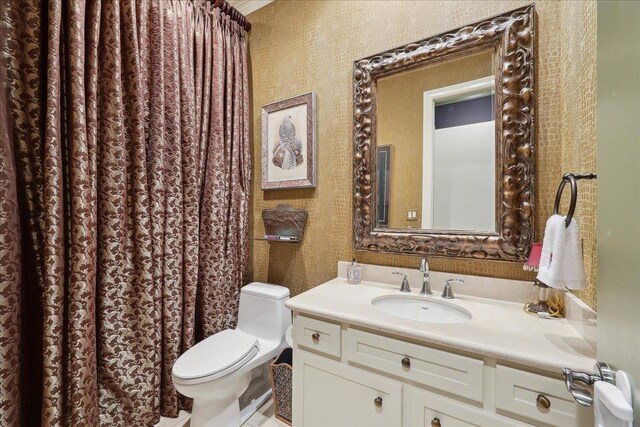 5160 Littlechase Dr, Beaumont, TX 77706 - full bathroom featuring toilet, vanity, and wallpapered walls