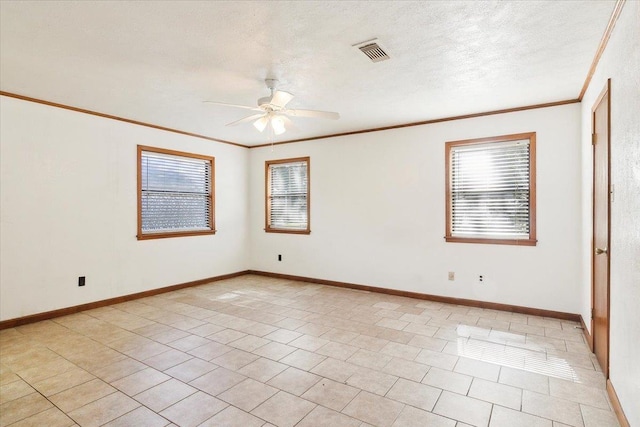 tiled spare room with a wealth of natural light, ceiling fan, and ornamental molding