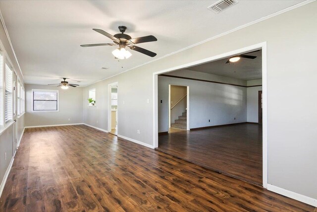 unfurnished room with ceiling fan, dark hardwood / wood-style flooring, and ornamental molding