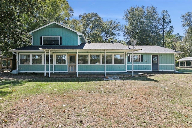 view of front facade with a pergola and a front lawn