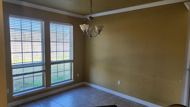 unfurnished dining area featuring tile patterned flooring, ornamental molding, and a notable chandelier