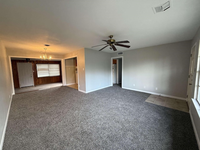 interior space featuring ceiling fan with notable chandelier