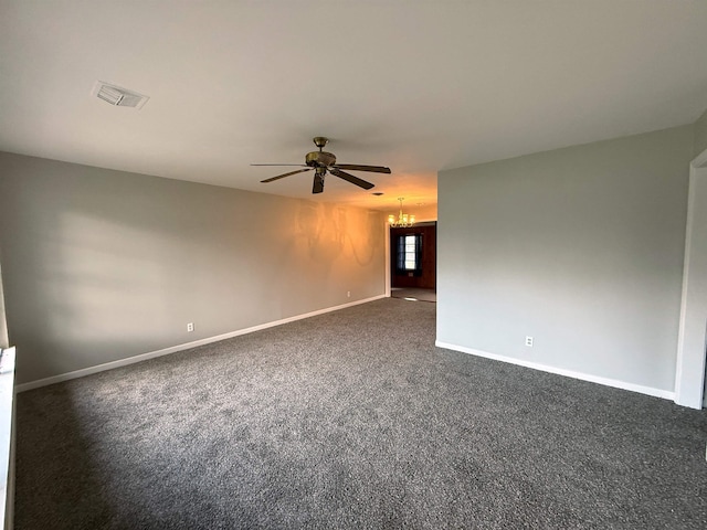 unfurnished room with ceiling fan with notable chandelier and dark colored carpet