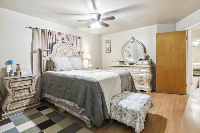 bedroom with ceiling fan and light hardwood / wood-style flooring