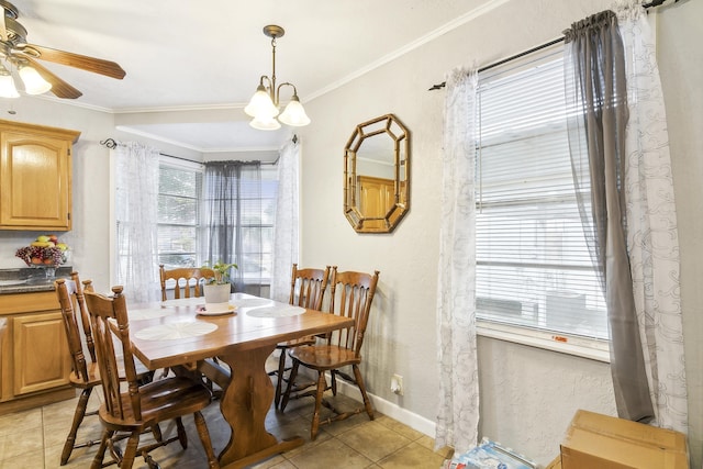 tiled dining space with crown molding and ceiling fan with notable chandelier