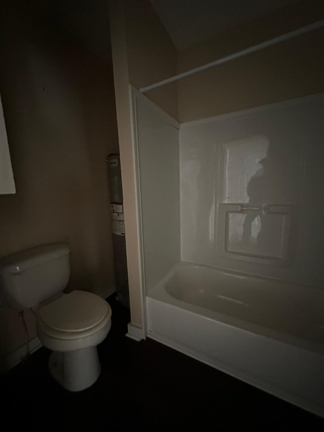 bathroom featuring toilet and tub / shower combination