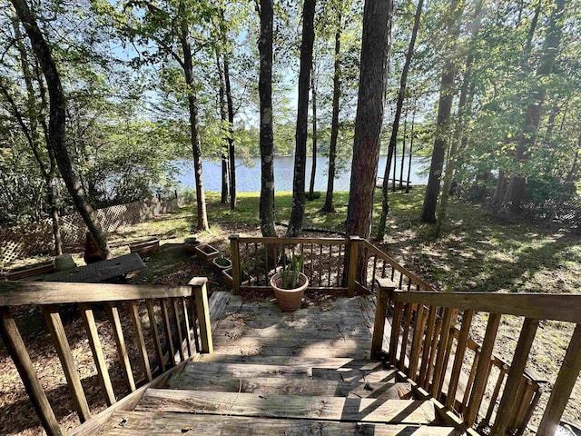 466 Galahad Loop Rd, Woodville, TX 75979 - wooden deck with a water view
