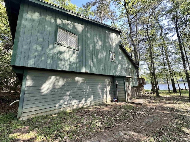 466 Galahad Loop Rd, Woodville, TX 75979 - view of side of home with a water view