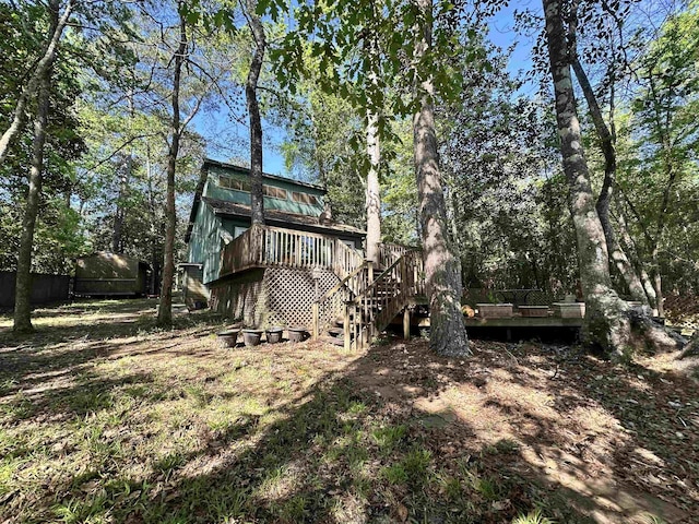 466 Galahad Loop Rd, Woodville, TX 75979 - exterior space with stairs, an outdoor structure, and a wooden deck