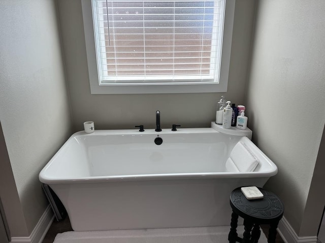 bathroom featuring a bath