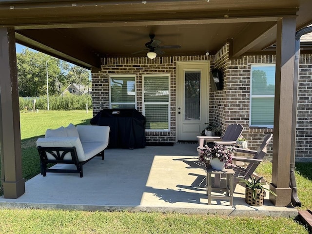 view of patio with ceiling fan, an outdoor hangout area, and grilling area