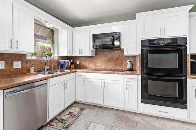 1135 Brandywine St, Beaumont, TX 77706 - kitchen with black appliances, white cabinetry, decorative backsplash, and light tile patterned floors