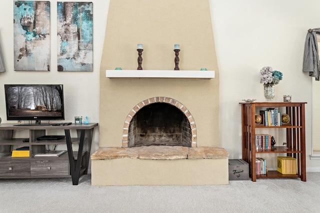 1135 Brandywine St, Beaumont, TX 77706 - living room featuring carpet flooring and a fireplace with raised hearth