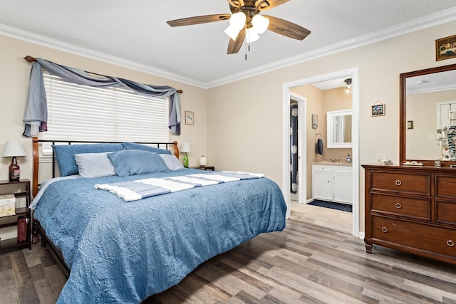 1135 Brandywine St, Beaumont, TX 77706 - bedroom with ornamental molding, wood finished floors, ceiling fan, and ensuite bath