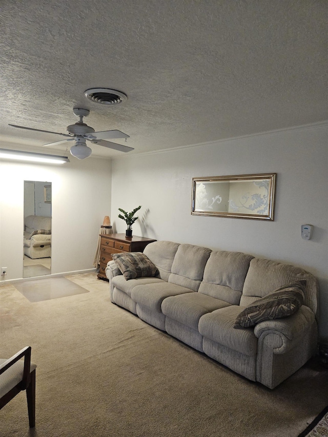 living room with carpet flooring, ceiling fan, and a textured ceiling